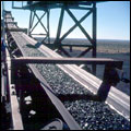 Crushed manganese ore being transported by conveyor belt at Wessels Mine in the Free State