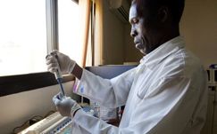 A doctor tests blood samples at a hospital laboratory. hiv, vaccine, aids, research, gates foundation