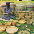Woman weaving baskets at Cathedral Peak, KwaZulu-Natal