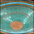 Decorative bowl incorporating a variety of shiny beads, made by a KZN crafts collective