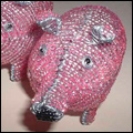 Pink pigs made from wire and beads