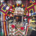 Ricksha driver in elaborately beaded and painted headdress