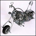 Toy Harley Davidson motorbike, helicopter and Beetle car made from wire