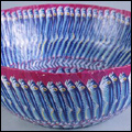 Paper mach bowl made from sardine tin labels