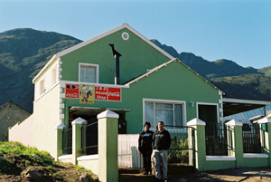 Joanna and Davy Sias outside their double-storey house